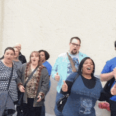 animated GIF of people from Book Riot Live 2016 cheering