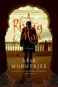 A Rising Man book cover: an intricate arch with silhouette of man.