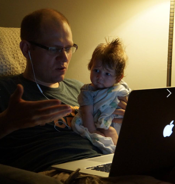 Jeff and baby daughter Rowan working on Book Riot together