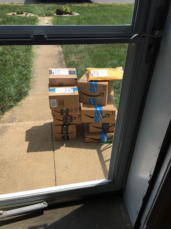 a tower of boxes piled on Rebecca's front step