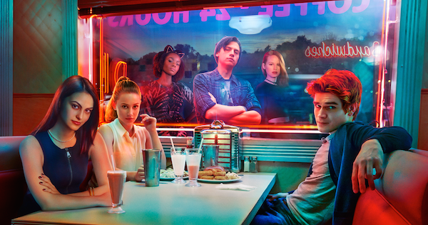 Riverdale poster: Archie, Veronica, Betty sitting in diner with shakes while Jughead, Josie, Cherly look in from outside window