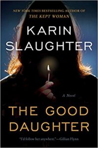 the good daughter cover image: silhouette of a woman holding up a lit match