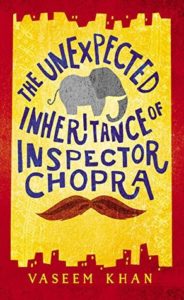 The Unexpected Inheritance of Inspector Chopra cover design: yellow with red border with an elephant between title words and a mustache at the bottom
