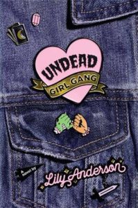 cover image: jean pocket with a pink heart pin that says undead girl gang