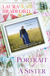 a framed photo of an Amish woman walking through a field. the framed photo is resting on top of a quilt.