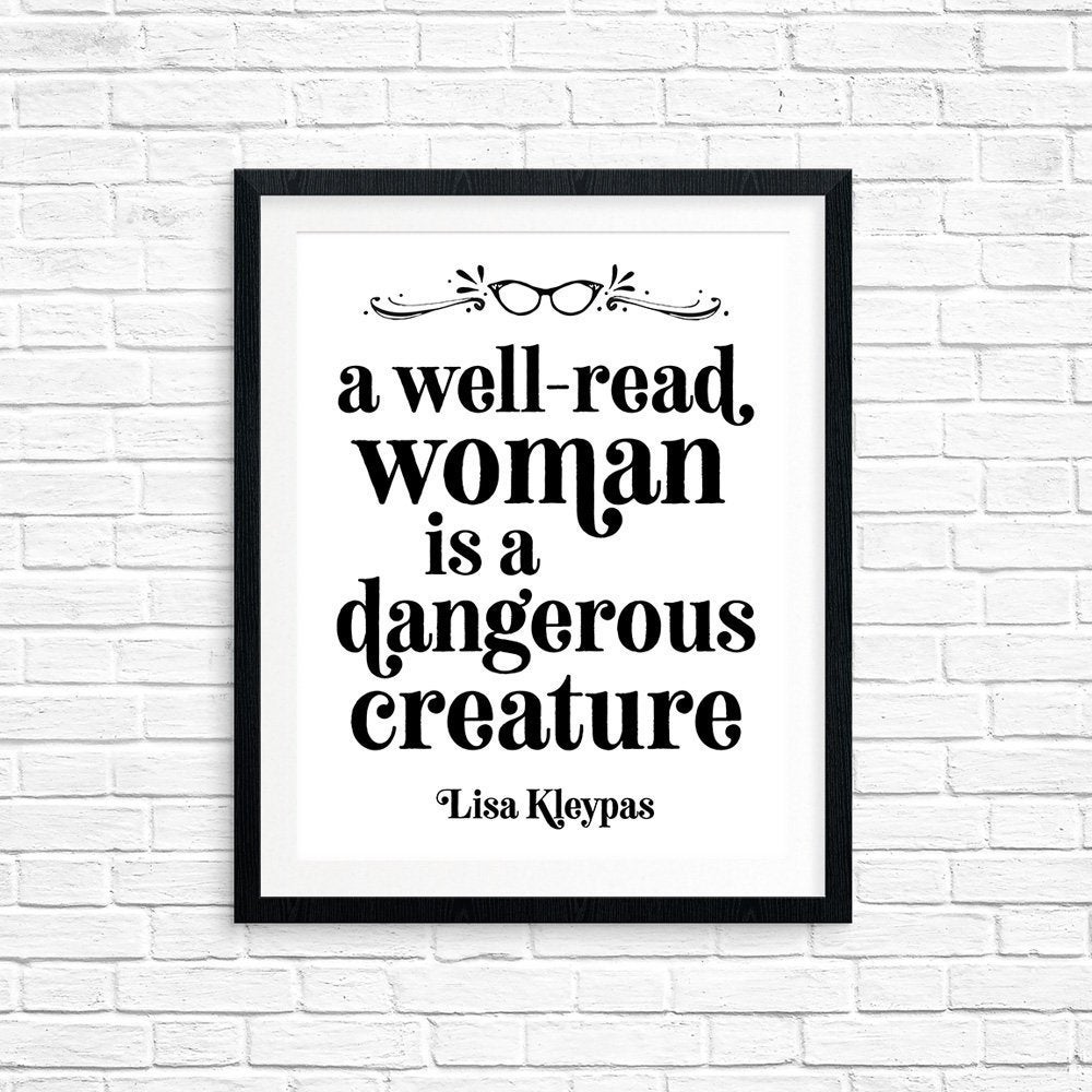 photo of a piece of wall art that says "A well-read woman is a dangerous creature" - Lisa Kleypas