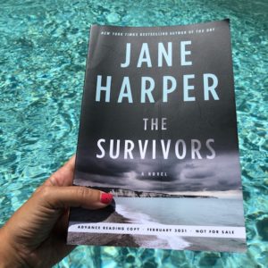 The Survivors by Jane Harper galley over pool water