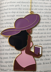 enamel bookmark of a Black woman from behind in a swimsuit and hat holding a book