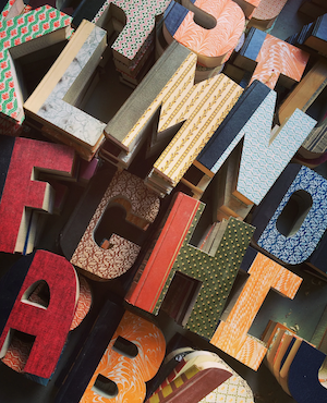 books cut into shapes of alphabet letters