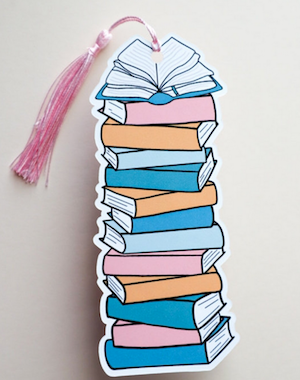 a bookmark of an illustrated stack of books that you can write book titles on