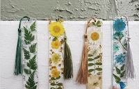 A photo of bookmarks made of flowers encased in clear resin