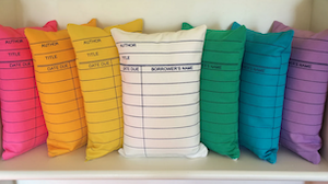 pillows made to look like library cards in a variety of colors