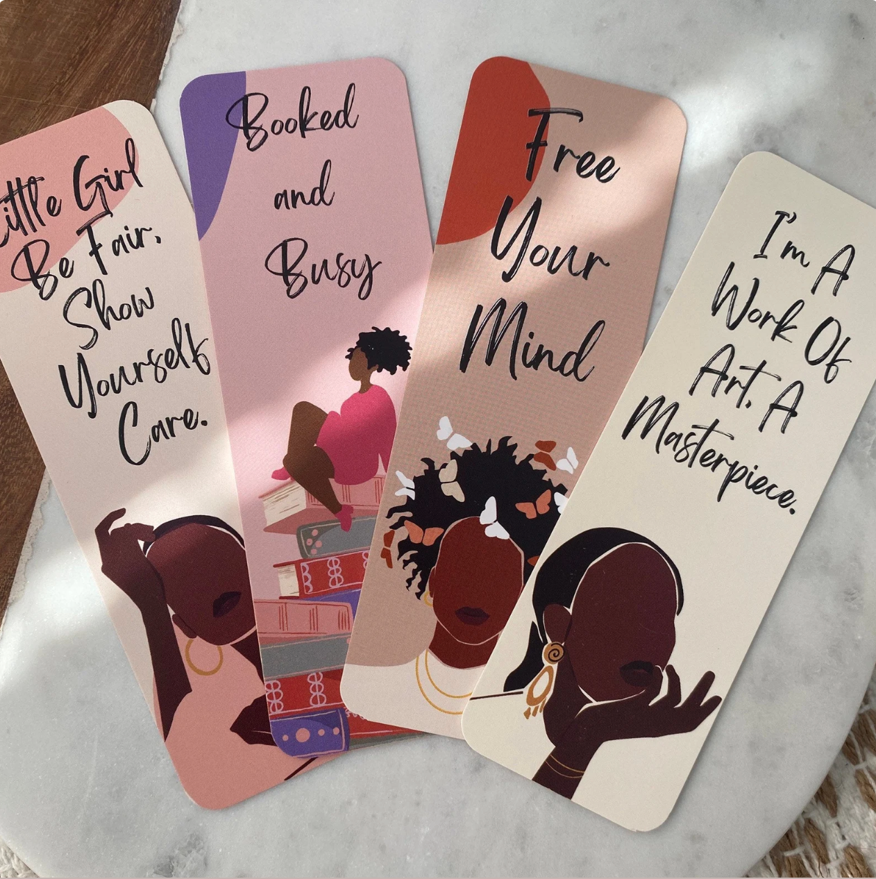 4 bookmarks with Black women silhouettes and quotes