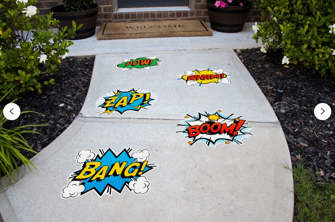 A walkway decorated with stickers displaying comic-style onomatopoeias