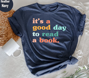 navy tshirt with colorful lowercase letters saying "it's a good day to read a book."