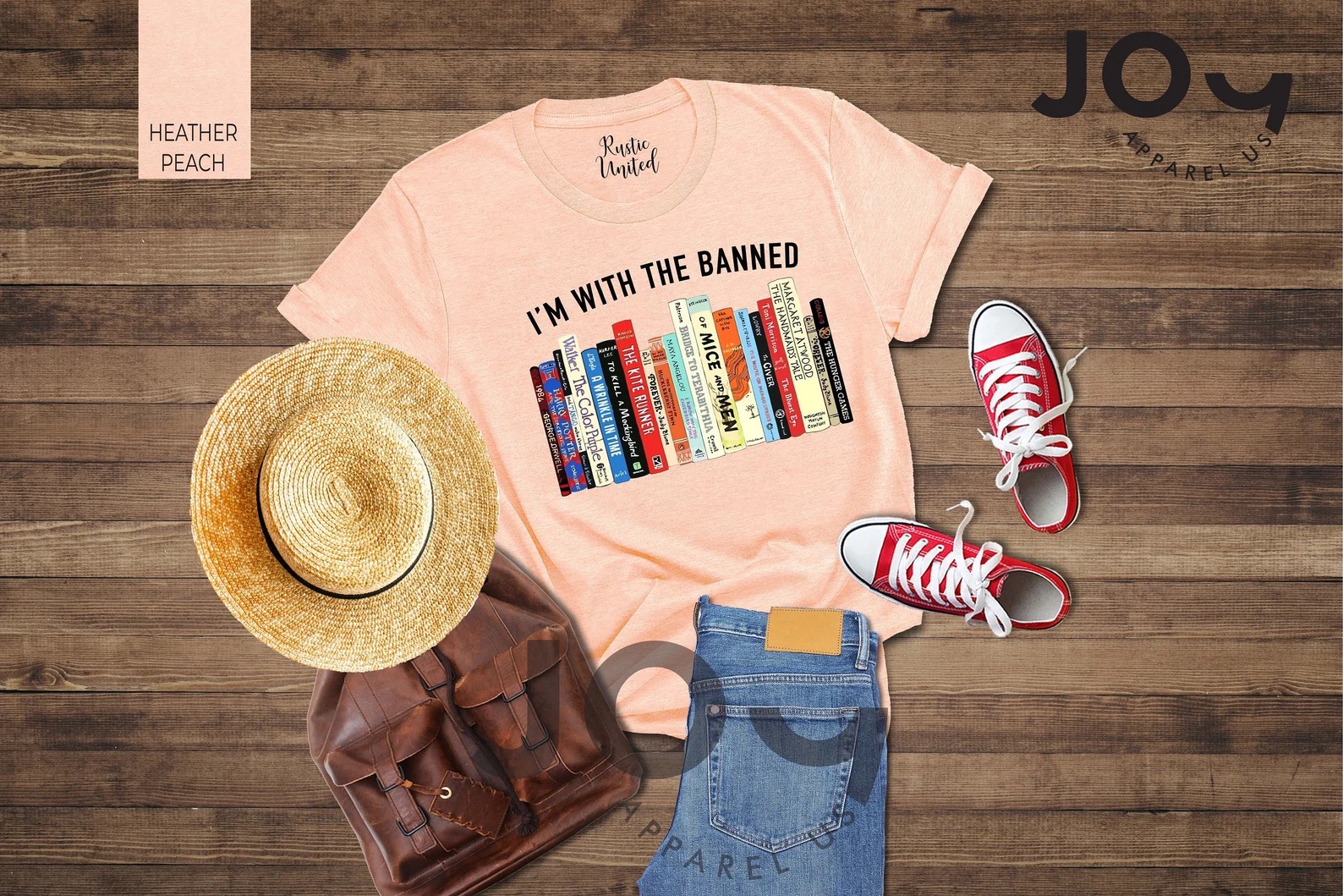 A photo of a t-shirt featuring a graphic of a bookshelf with the caption "I'm with the damned"