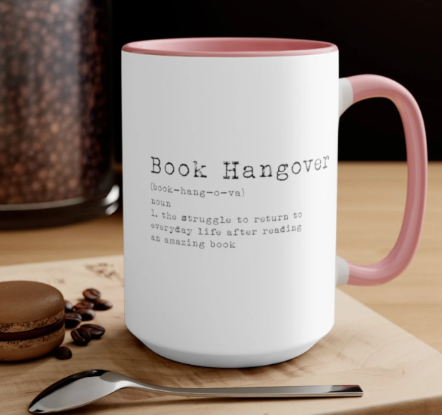 white coffee mug with the words "book hangover" on the side