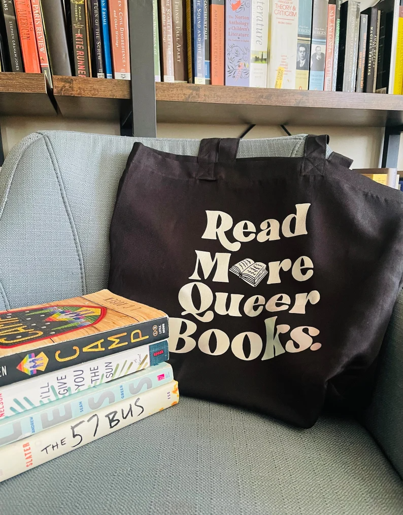 a photo of a read more queer books tote bag