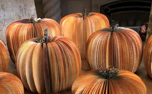 books cut and painted to look like 3D pumpkins