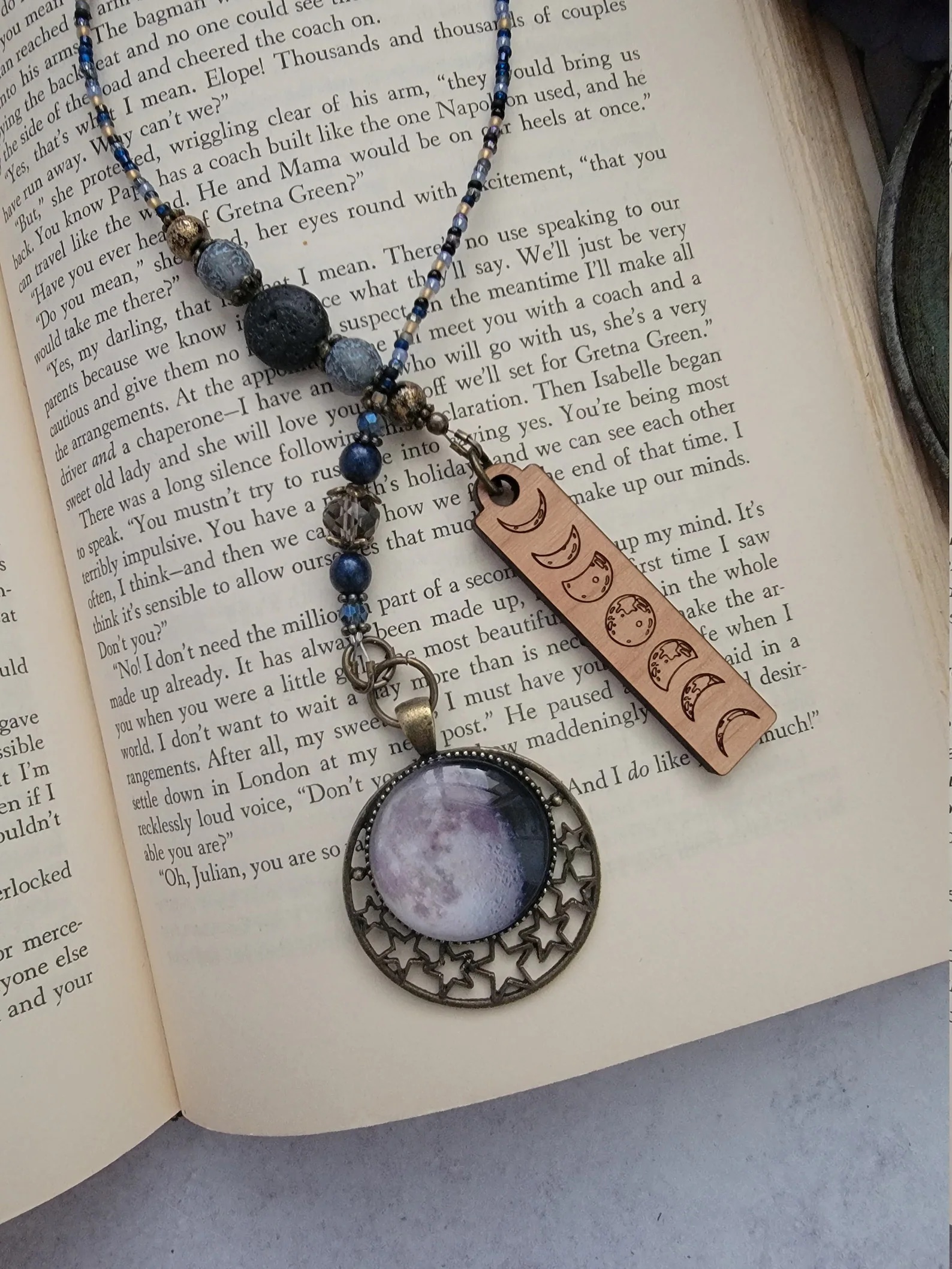 A bookmark featuring the phases of the moon.