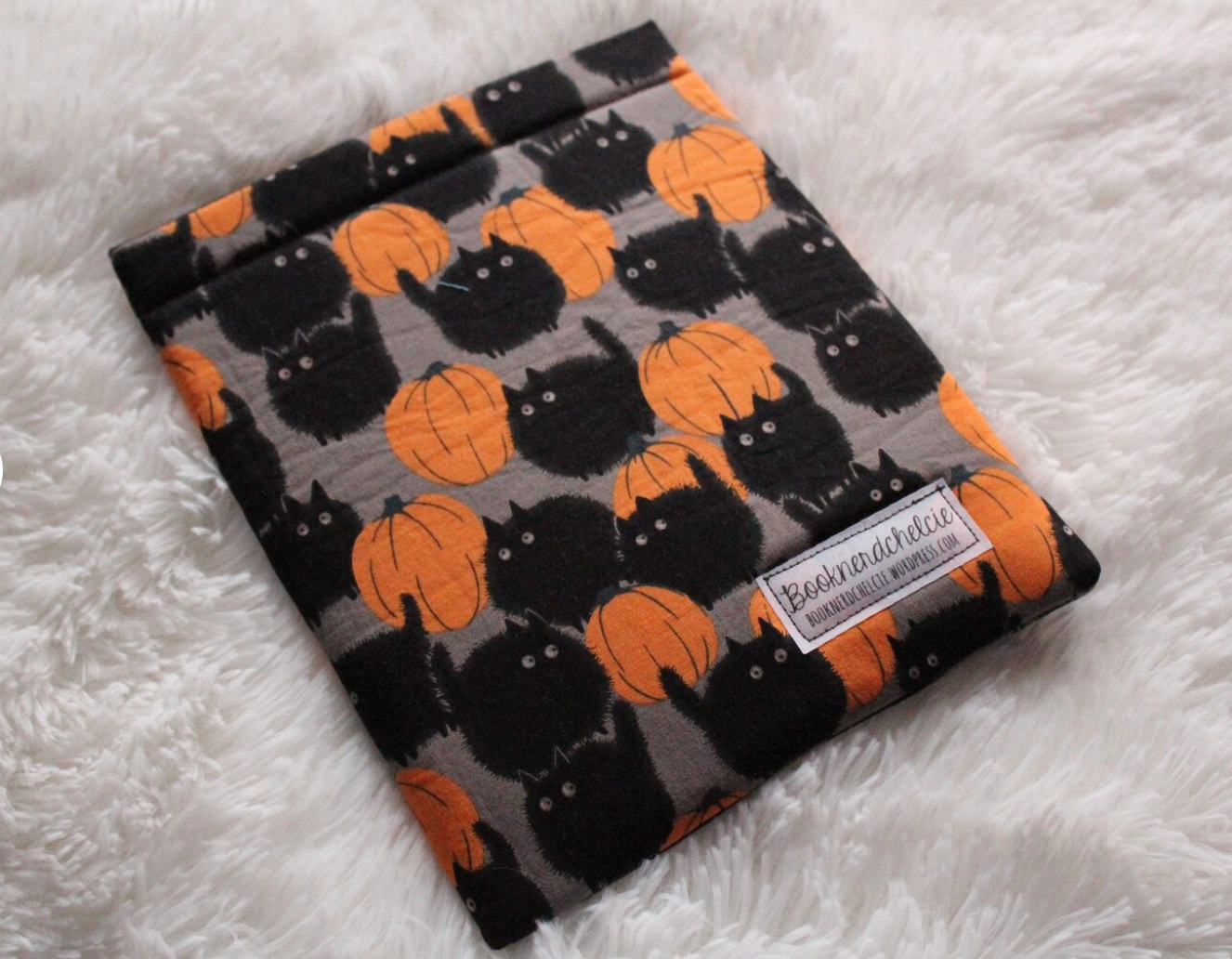 black cat and pumpkin book sleeve
