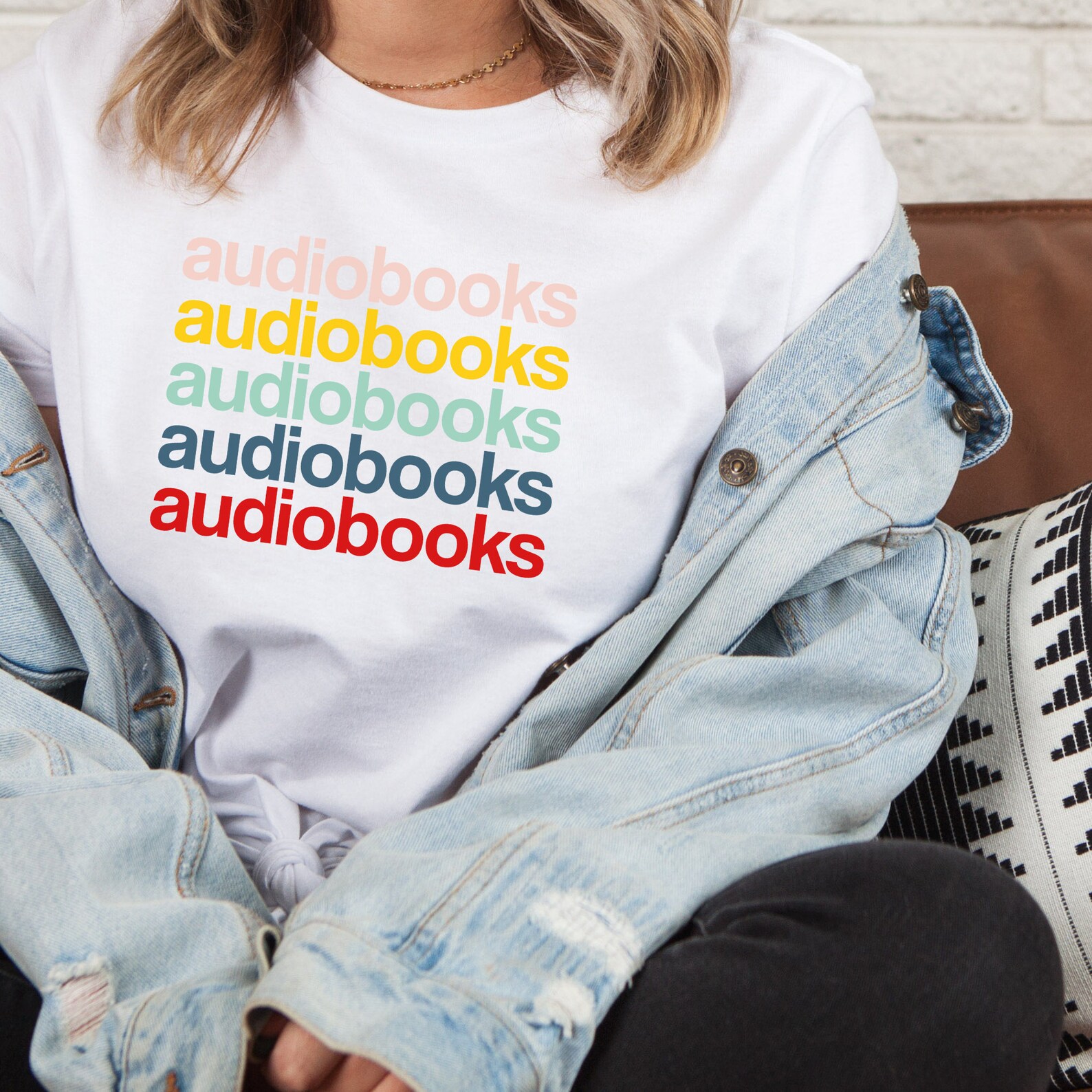 A photo of a white t-shirt with the word audiobooks lists in several different colors