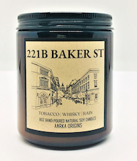 candle in a dark jar with a label saying 221b Baker ST and a sketch of the street
