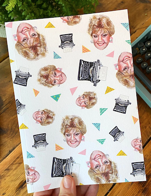 notebook with Angela Lansbury face doodle and typewriters on cover