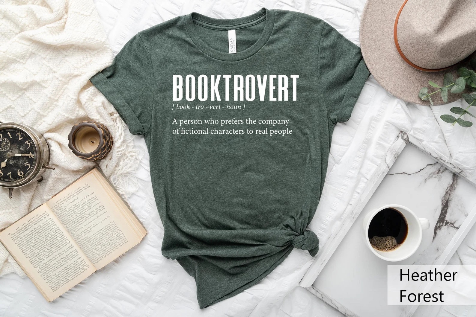 a photo of a green t-shirt with the word Booktrovert on the front