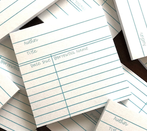 a pack of sticky notes designed to look like a library card