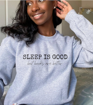 sweatshirt that says "sleep is good but books are better"