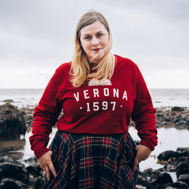 a photo of someone wearing a red sweatshirt that says Verona 1597