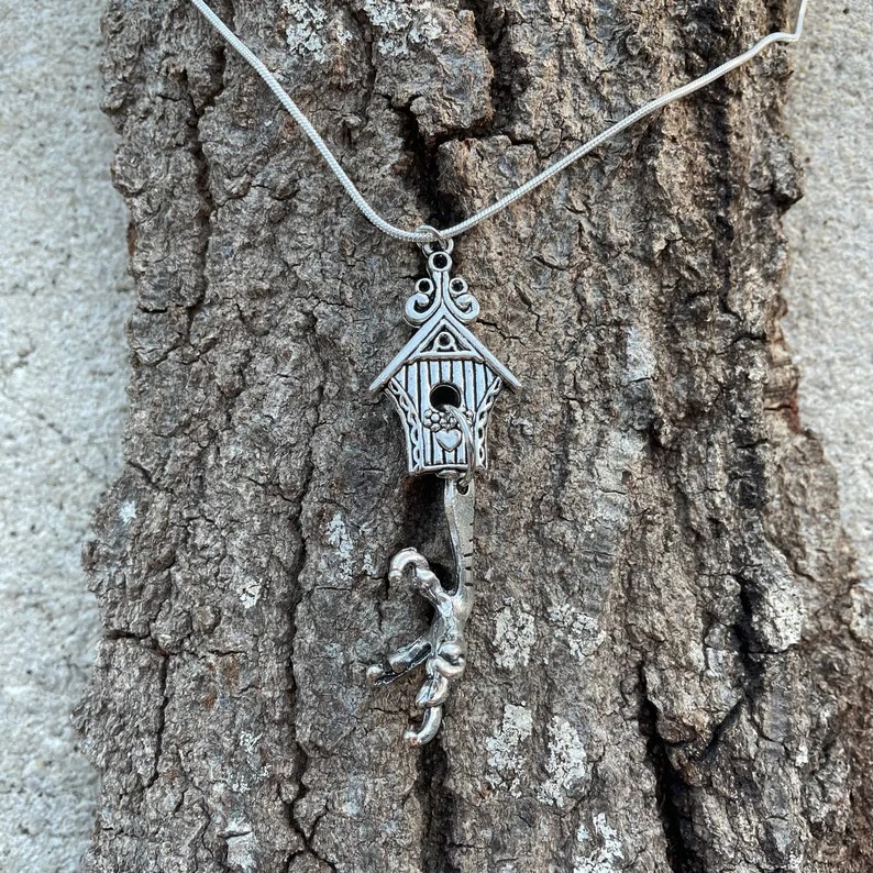 a photo of a Baba Yaga house necklace