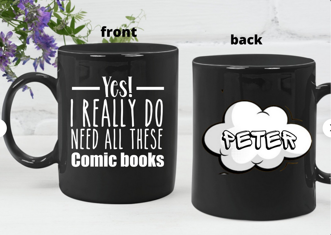 A black mug with white text that says "Yes! I really do need all these comic books"