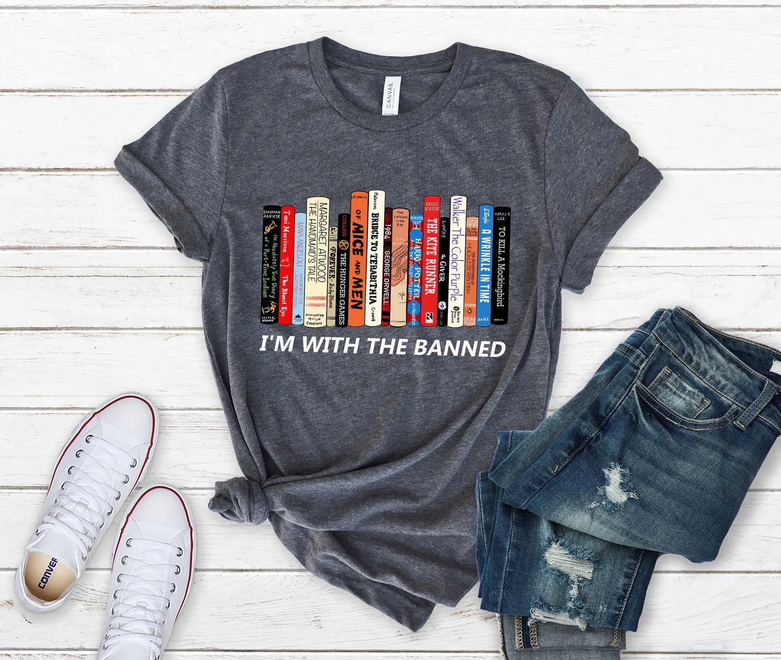 a photo of a t-shirt with a row of books on it that says "I'm with the banned."