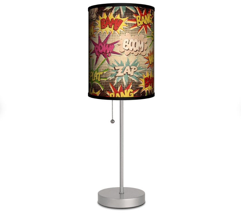 A table lamp with a shade covered in comic-style onomatopoeias