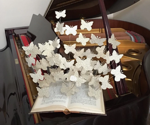 book with paper butterflies coming out