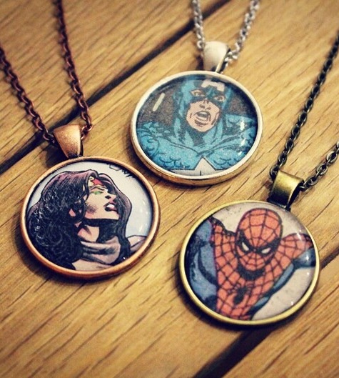 Three pendants with images of superheroes taken from comic book panels