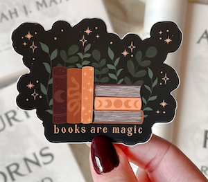graphic sticker wtih books that says "books are magic"