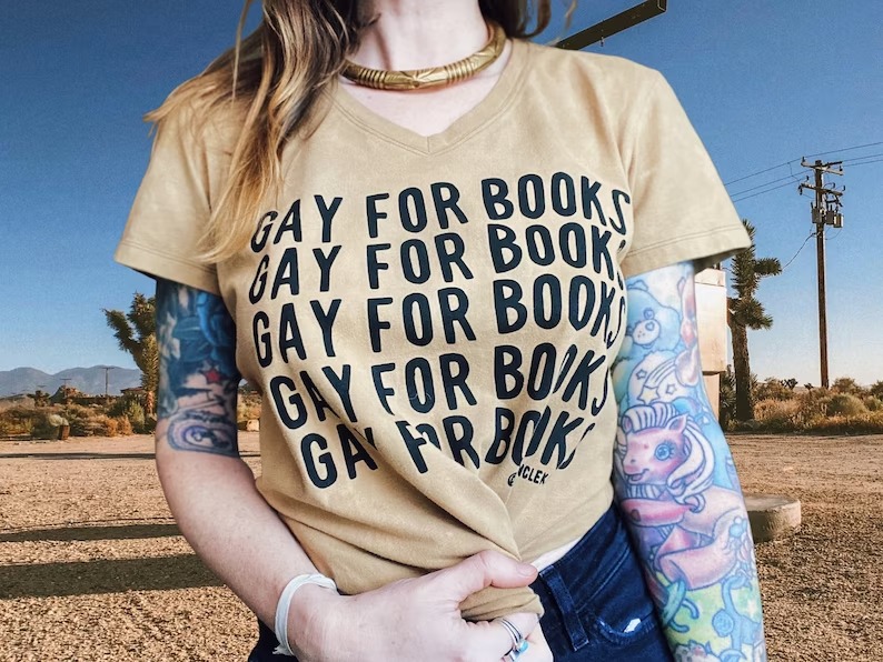 a photo of someone wearing a shirt that says Gay for Books in a repeating pattern