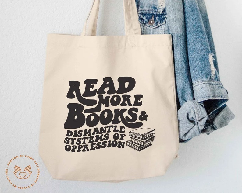 a tote bag with the text Read More Books & Dismantle Systems of Oppression