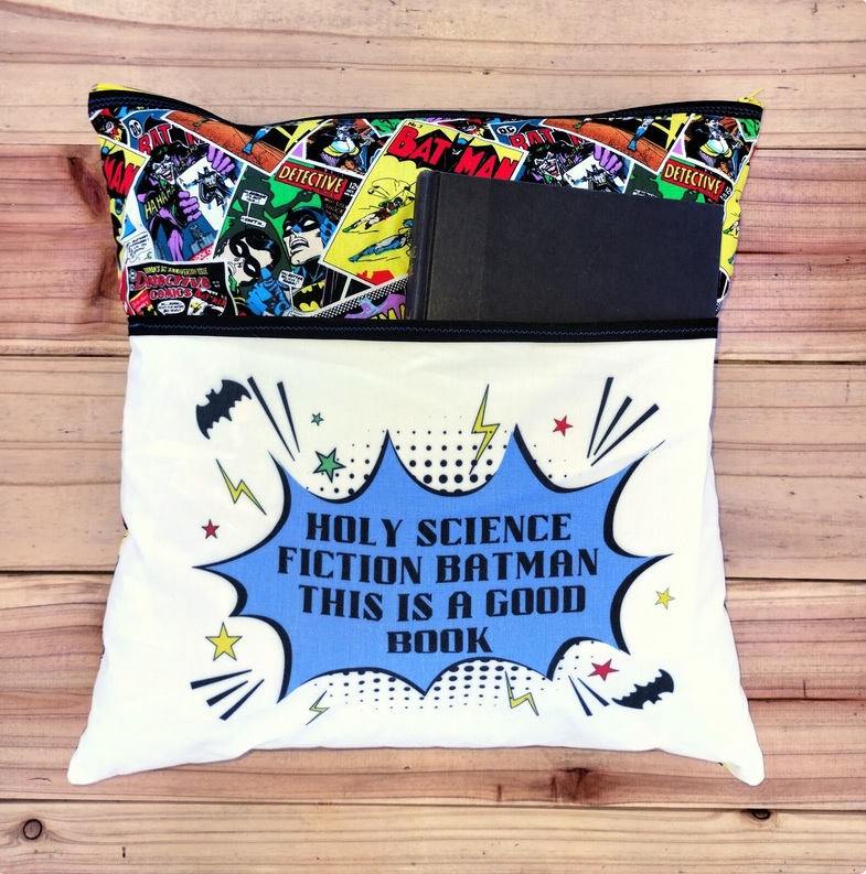 A Batman-themed pillow with a built-in pocket to hold books