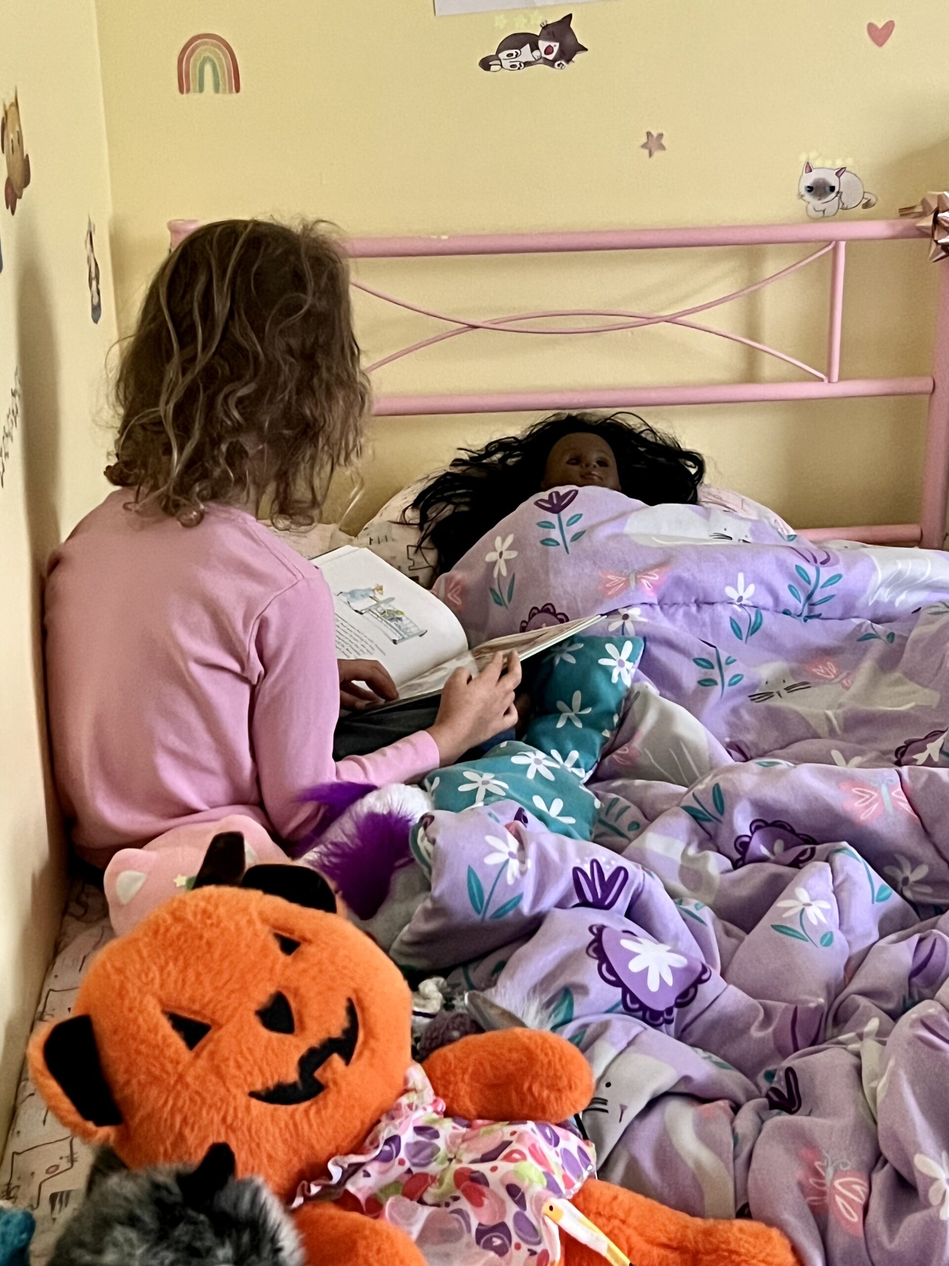 Marian reads to doll, The Kids Are All Right