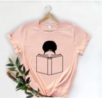 picture of t-shirt with girl with afro reading a book