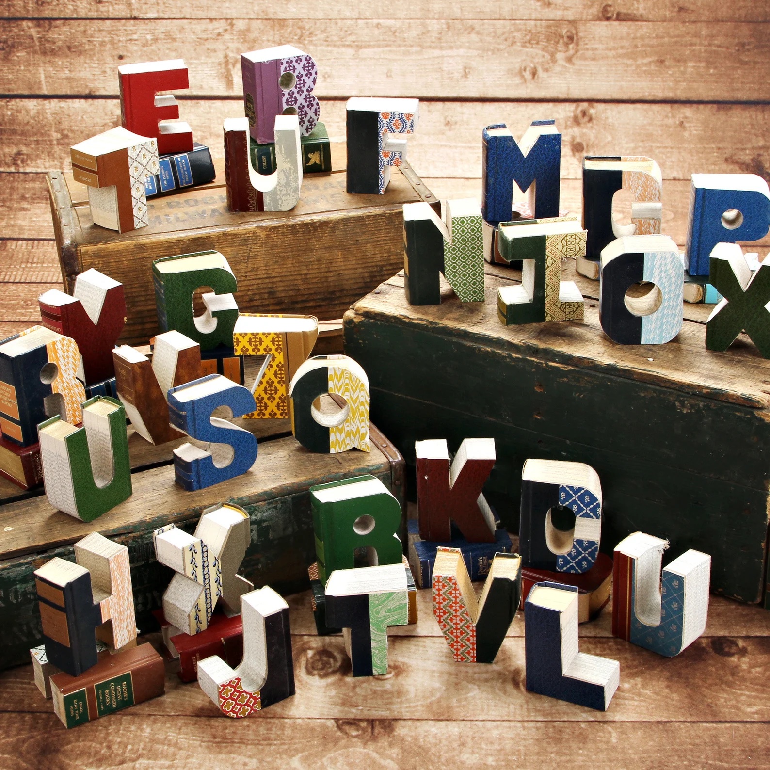 A photo of different letters cut out of books