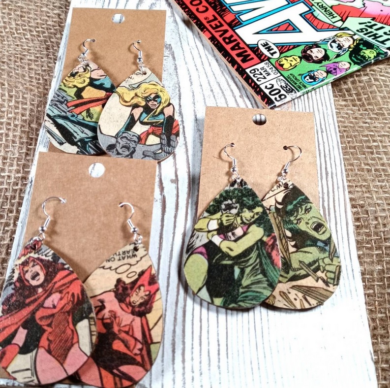 Teardrop-shaped earrings made from comic book panels featuring various female characters