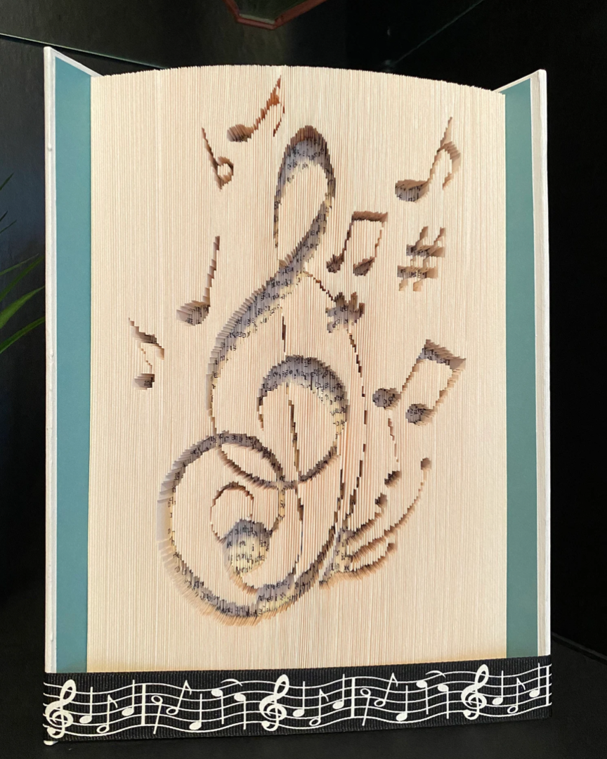 Music Notes Cut into Book Pages