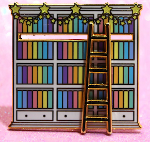 an enamel pin of a bookshelf with colorful books and a ladder