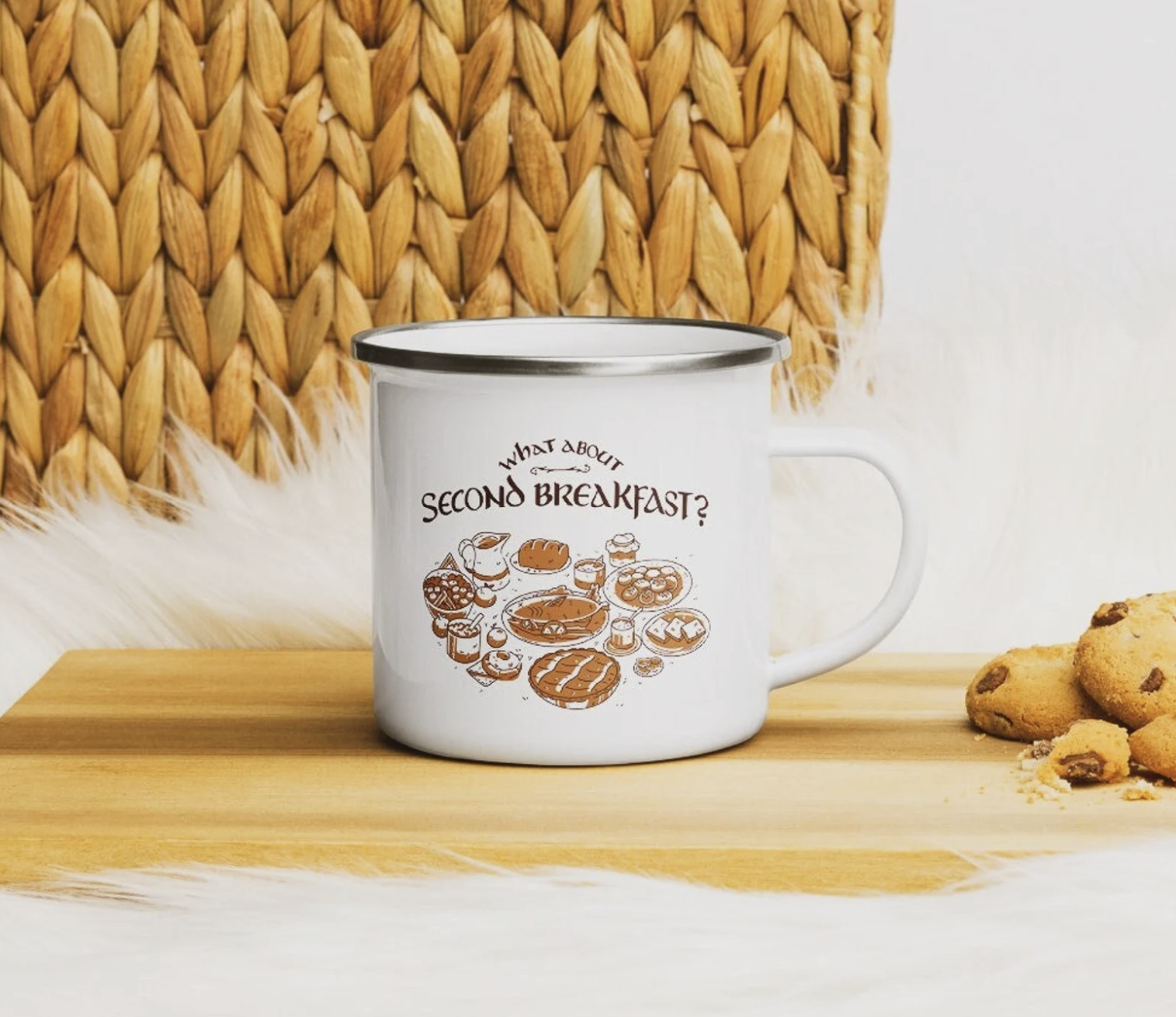 White camp mug with illustrations of a tasty hobbit breakfast  and the text "what about second breakfast?"