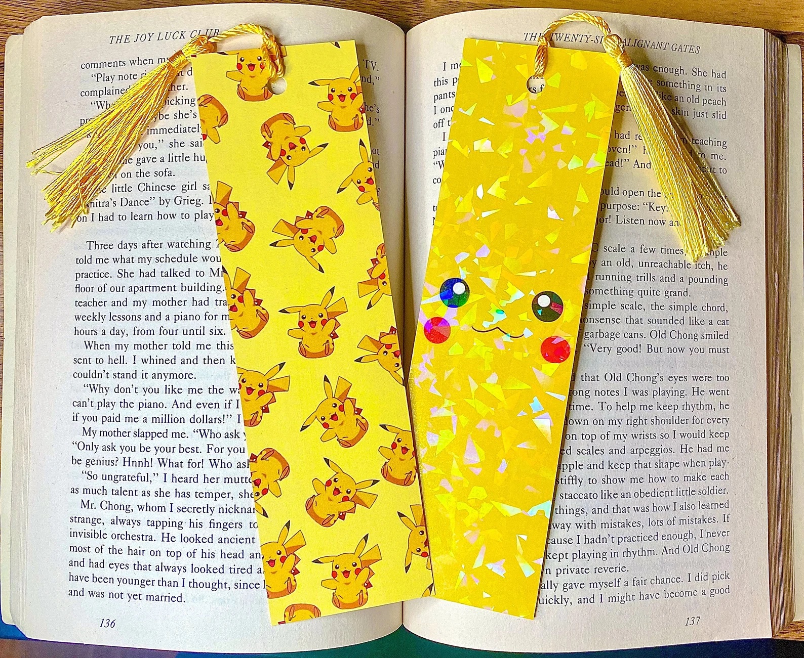 a photo of a Pikachu-themed bookmark sitting on an open book